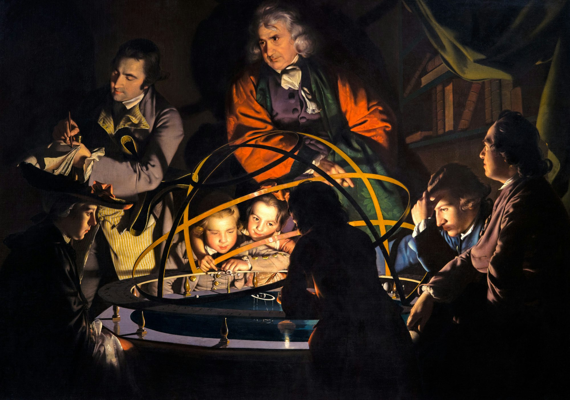 A group gathered around an illuminated mechanical model of the solar system